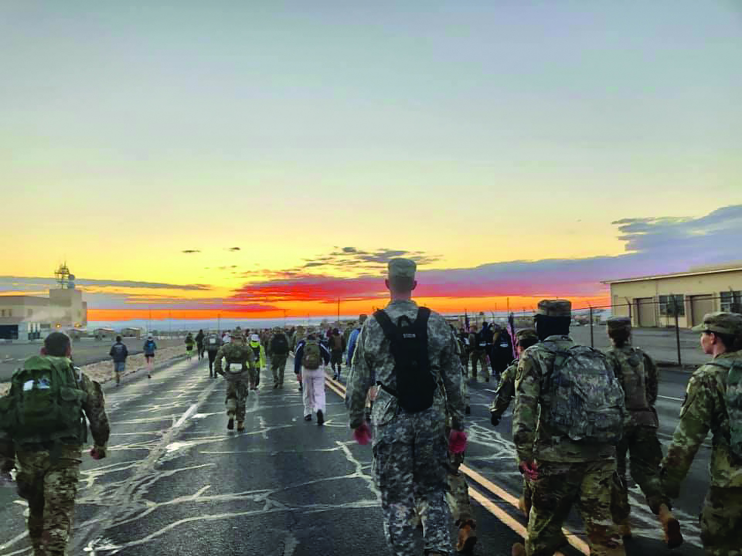 A stunning sunrise greeted the marchers at the 2019 Bataan Memorial Death March after it snowed the
        day prior. (Photo courtesy of COL Ku)